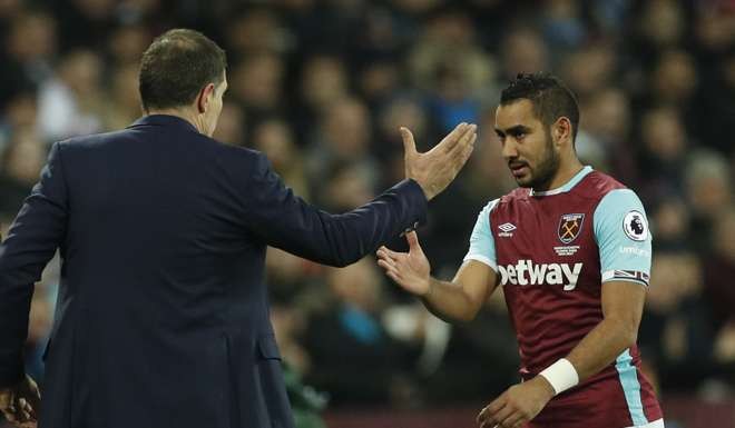 West Ham United's Dimitri Payet shakes the hand of manager Slaven Bilic.