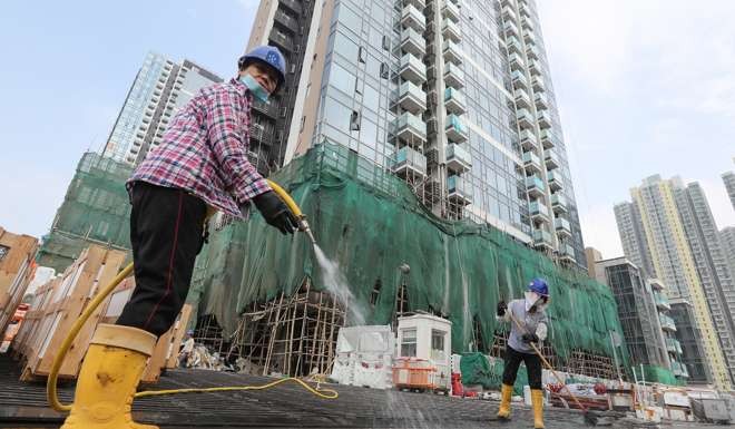 Workers at One Kai Tak. Photo: Edward Wong