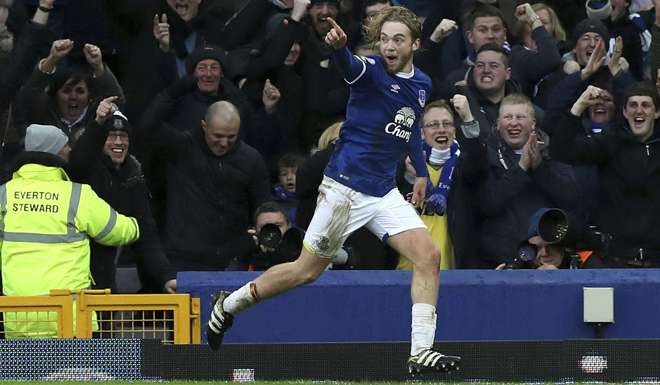 Everton's Tom Davies celebrates scoring his side's third goal against Manchester City. Photo: AP