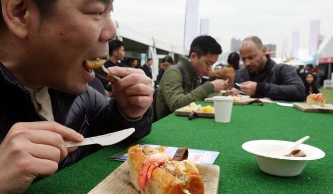 Festival-goers sample some of the treats on offer on the opening day last year. Photo: Nora Tam