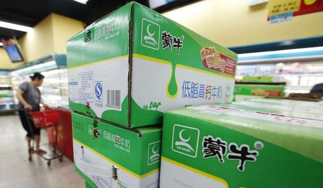 Mengniu Dairy products at a supermarket in Beijing in June 2013. Food safety became a hot topic after Mengniu was among three leading Chinese infant formula makers blamed in 2008 for using toxic industrial melamine to boost protein readings, which led to the deaths of six babies and made more than 300,000 others ill. Photo: Reuters