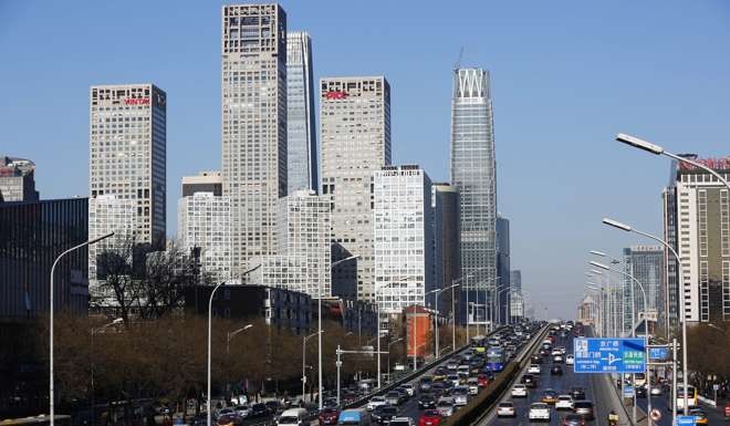 Vehicles clog a street in Beijing’s CBD. Photo: EPA