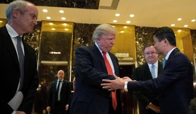 President-elect Donald Trump shakes hands with Jack Ma, Chairman of Alibaba Group, following a meeting where Ma offers to create a million US jobs. Photo: AFP