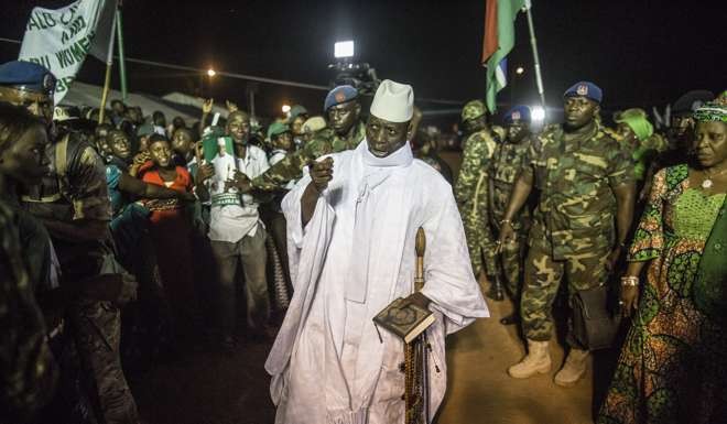A photo taken on November 24, 2016 in Brikama shows Gambia's incumbent President Yahya Jammeh greeted by supporters as he arrives at a campaign rally ahead of the December 1 presidential election, which he went on to lose. Photo: AFP