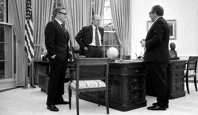 Then-president Gerald Ford (centre) meets secretary of state Henry Kissinger (right) and vice-president Nelson Rockefeller in the Oval Office in April 1975 to discuss the American evacuation of Saigon. Photo: Gerald R. Ford Library via AP