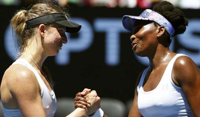 Venus Williams shakes hands after winning her match against Germany's Mona Barthel. Photo: Reuters
