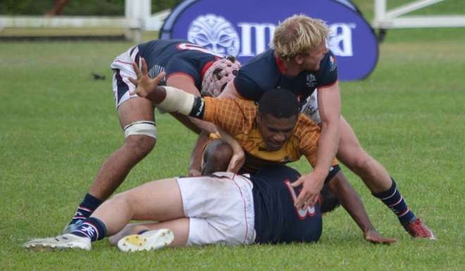 Jamie Hood and Chris Maize support Charles Higson-Smith in the tackle against Wardens.