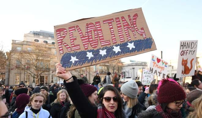 Protesters take part in the Women's March in London. Photo: Reuters