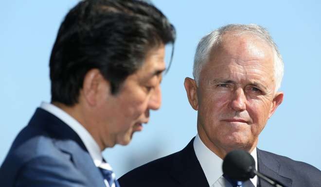 Japan's Prime Minister Shinzo Abe (left) speaks as Australia's Prime Minister Malcolm Turnbull looks on during a press conference at Kirribilli House in Sydney, Australia, on January 14. Photo: EPA