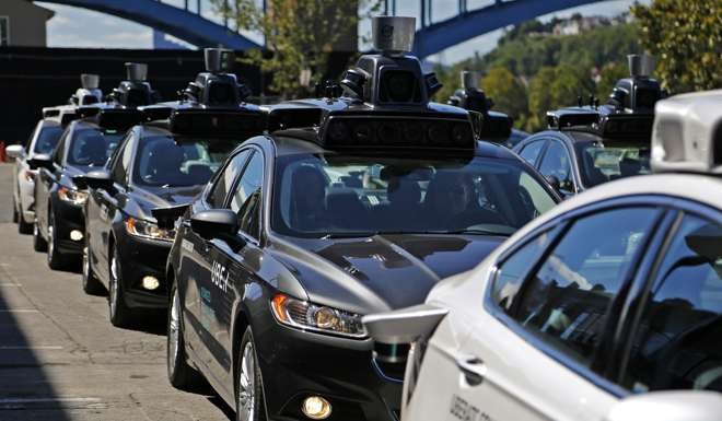 A group of self-driving Uber vehicles position themselves to take journalists on rides during a media preview at Uber's Advanced Technologies Center in Pittsburgh. Photo: AP