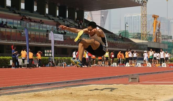 Theophilus Chan Ming-tai in action at the 2013 Hong Kong Athletics League at Wan Chai Sports Ground.