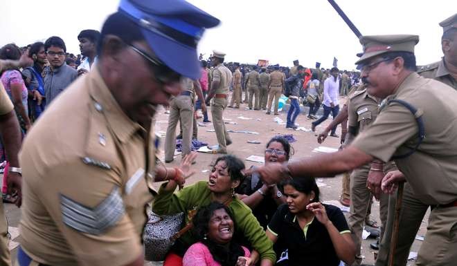Police remove demonstrators from Marina beach during a protest demanding a permanent solution to protect the sport of jallikattu. Photo: Reuters