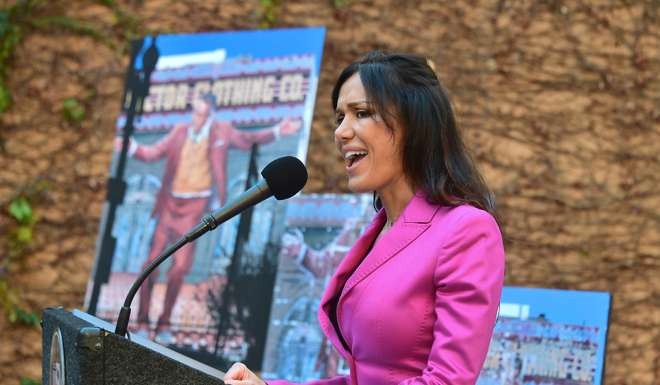Valentina Castelliani, spouse of the late Francesco Quinn, speaks at a ceremony for the mural restoration by Eloy Torres of Oscar-winning Actor Anthony Quinn's 70-foot-tall 