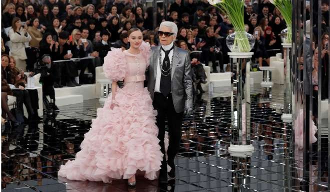 Karl Lagerfeld with Lily-Rose Depp at his Haute Couture Spring/Summer 2017 fashion show for Chanel. Photo: REUTERS