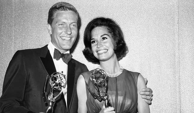 This May 25, 1964 file photo shows Dick Van Dyke, left, and Mary Tyler Moore, co-stars of 