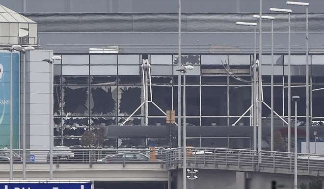 A photo taken on March 22, 2016 shows the damaged facade of Brussels airport in Zaventem after at least 13 people were killed and 35 injured as twin blasts rocked the main terminal. Photo: AFP