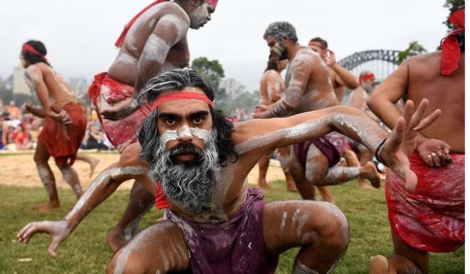 Koomurri people and representatives of aboriginal groups perform the Smoking Ceremony and Dance as part of Australia Day celebrations in Sydney. Photo: EPA