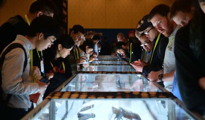 Attendees view a display of the CES Innovation Awards at the 2017 Consumer Electronic Show (CES) in Las Vegas, Nevada on January 8, 2017. Photo: AFP