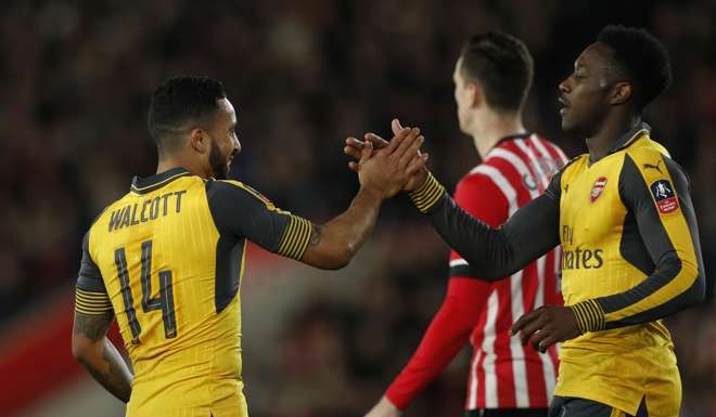 Theo Walcott and Danny Welbeck celebrate a goal in Arsenal’s win over Southampton. Photo: Reuters