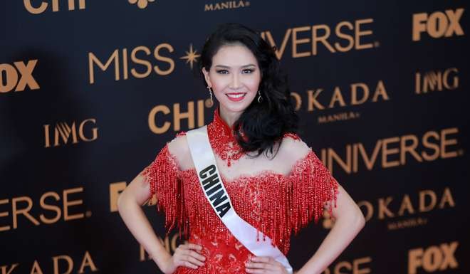 Miss China Li Zhenying poses for photos during the Miss Universe red carpet event in Pasay City. Photo: Xinhua