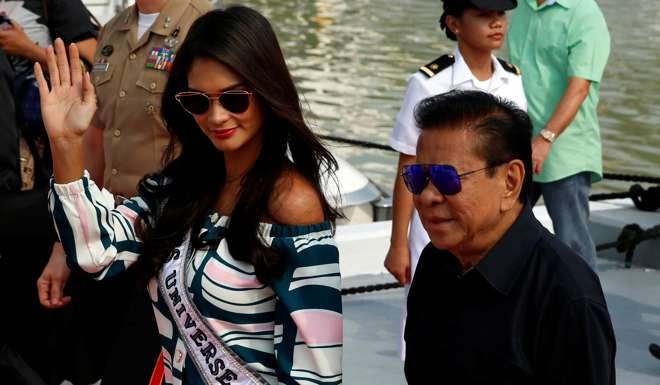 Filipino tycoon Luis ‘Chavit’ Singson escorts former Miss Universe Pia Wurtzbach in Manila. Photo: Reuters