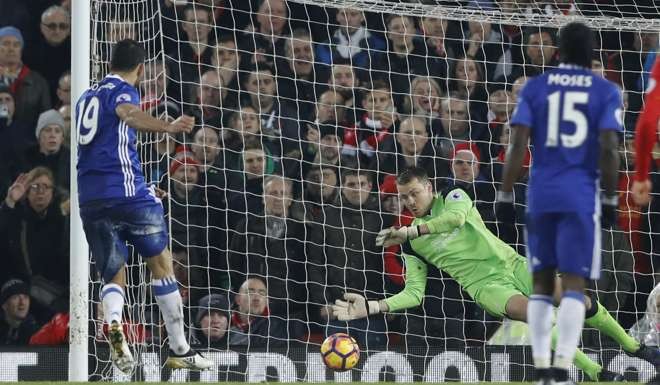 Diego Costa’s penalty is saved by Simon Mignolet.