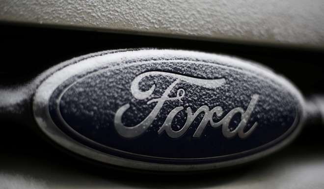 Snowflakes are seen on the badge of a Ford car. Photo: Reuters