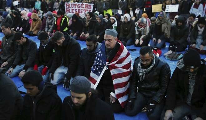 Rutgers University students and supporters gather for Muslim prayers during a rally in New Jersey last month to express discontent with President Donald Trump’s executive order barring some immigrants from entering the US. Photo: AP