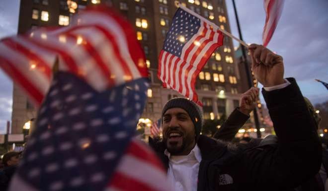 People rally at Brooklyn Borough Hall as Yemeni grocery stores shut down to protest against US President Donald Trump's executive order banning immigrants and refugees from seven Muslim-majority countries. Photo: AFP