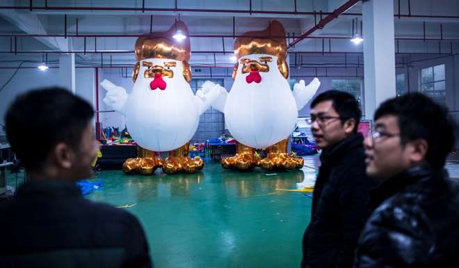 Workers stand in front of inflatable chickens resembling Donald Trump in a factory in Jiaxing, Zhejiang, in the run-up to the Lunar New Year. Trump’s vitriol was initially met with anger from Beijing. That soon turned to laughter at what the Chinese press perceived as amateur statesmanship. Photo: AFP