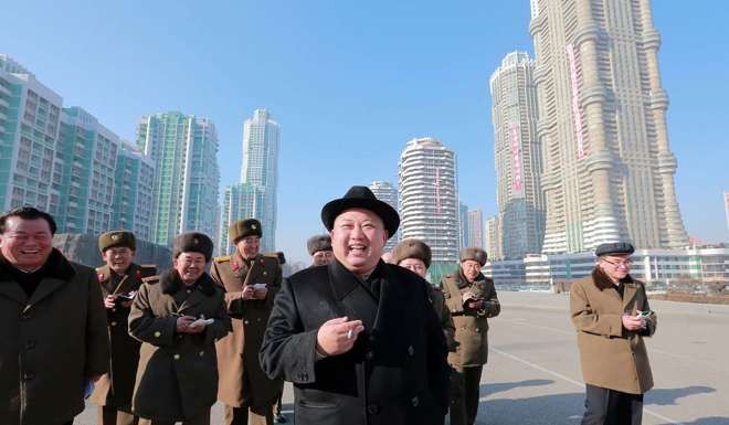 North Korean leader Kim Jong-un pictured inspecting housing blocks. His consolidation of power has included purges and executions of top officials. Photo: AFP