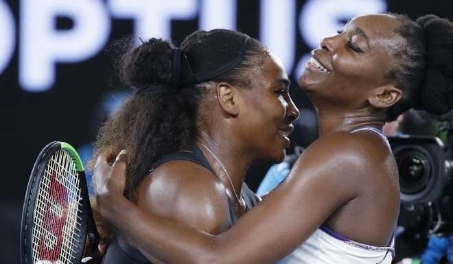 Serena Williams and sister Venus embrace after their historic match in Melbourne. Photo: AP