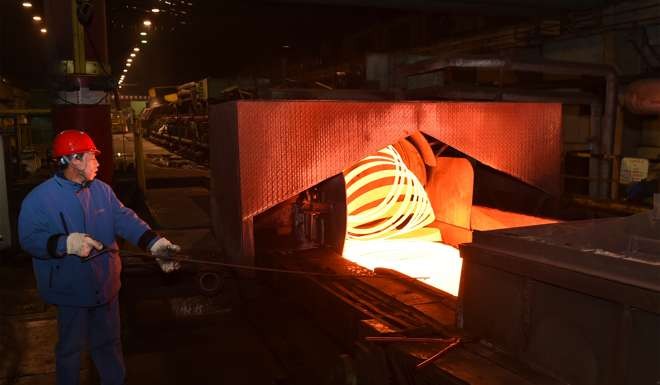 An employee works on a production line at Taiyuan Iron and Steel in Taiyuan, Shanxi Province. Photo: Xinhua