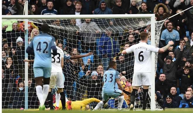 Brazilian striker Gabriel Jesus (second from right)) scores Manchester City’s late winning goal. Photo: AFP