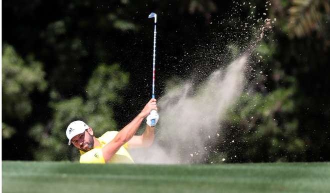 Sergio Garcia hits a bunker shot on his way to victory in Dubai. Photo: AFP