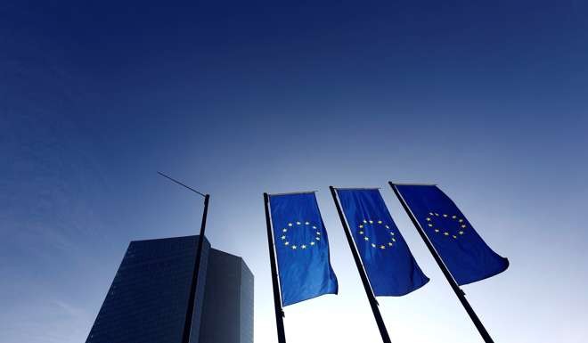 Flags flutter at the European Central Bank (ECB) headquarters. Photo: Reuters