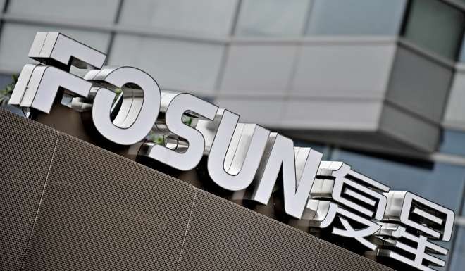 The logo of Fosun Group is seen in front of the company's headquarters building in Shanghai. Photo: AFP