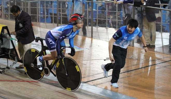 Hong Kong's Sarah Lee is encouraged by a team official on her way to gold at the Asian Championships. Photo: Handout